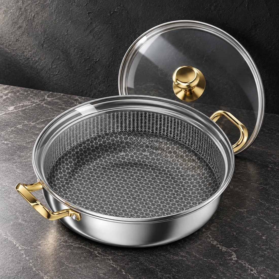 Steel pan with dark patterned interior, gold-tone handles and a glass lid